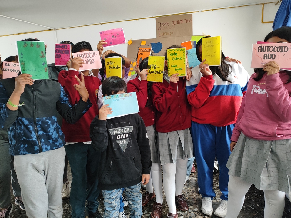 Children in the participation group showing their self-care booklet